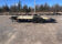 2026 Quality Steel & Aluminum 8320TILTEH14K Hydraulic Tilt Equipment Hauler on a gravel lot, showcasing its advanced tilting mechanism and robust construction.