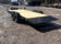 2026 Quality Steel & Aluminum 8320TILTEH14K Hydraulic Tilt Equipment Hauler on a gravel lot, showcasing its advanced tilting mechanism and robust construction.