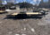 2026 Quality Steel & Aluminum 8320TILTEH14K Hydraulic Tilt Equipment Hauler on a gravel lot, showcasing its advanced tilting mechanism and robust construction.