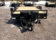 2026 Quality Steel & Aluminum 8320TILTEH14K Hydraulic Tilt Equipment Hauler on a gravel lot, showcasing its advanced tilting mechanism and robust construction.