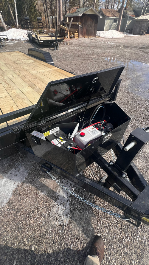 2026 Quality Steel & Aluminum 8320TILTEH14K Hydraulic Tilt Equipment Hauler on a gravel lot, showcasing its advanced tilting mechanism and robust construction.