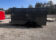 Sleek Discovery 7x16 Rover ET Enclosed Trailer with Blackout Package, showcased in an outdoor setting.