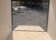 Sleek Discovery 7x16 Rover ET Enclosed Trailer with Blackout Package, showcased in an outdoor setting.