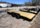 2025 BNM 7x18 Car/Toy Hauler with rear beavertail, pullout ramps, and black wheels