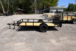 2025 BNM 6x12 Heavy Duty Low Side Utility Trailer in black with fold-in gate