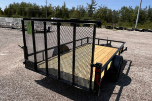 2025 BNM 6x12 Heavy Duty Low Side Utility Trailer in black with fold-in gate