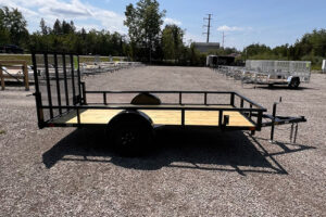 2025 BNM 6x12 Heavy Duty Low Side Utility Trailer in black with fold-in gate
