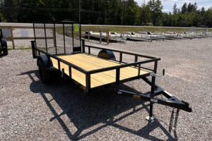 2025 BNM 6x12 Heavy Duty Low Side Utility Trailer in black with fold-in gate
